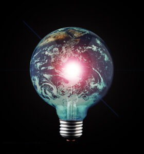 Glowing Earth bulb against a black background