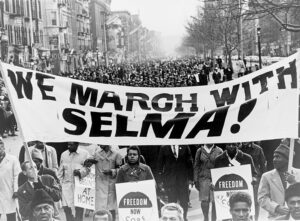 Marchers carrying banner lead the way as 15,000 parade in Harlem, New York. Photo: Library of Congress Prints and Photographs Division [LC-USZ62-135695]