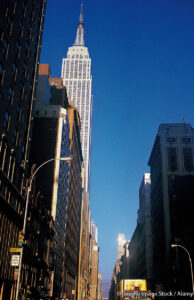 Street-level image of the Empire State Building as seen looking West from Park Avenue (probably on 35th Street). ©TongRo Image Stock / Alamy. MHE World.