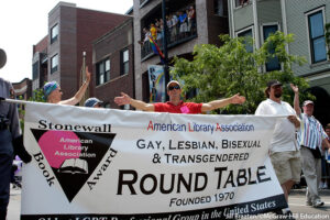 American Library Association Gay, Lesbian, Bisexual & Transgendered Round Table parade banner being carried by members in the Chicago gay pride parade. Jill Braaten/©McGraw-Hill Education. MHE World.