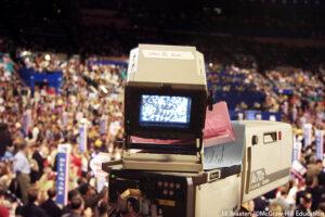 Television camera as it pans the crowd at the 2004 Republican National Convention. Jill Braaten /©McGraw-Hill Education. MHE World.