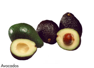 sliced avocadoes on white background