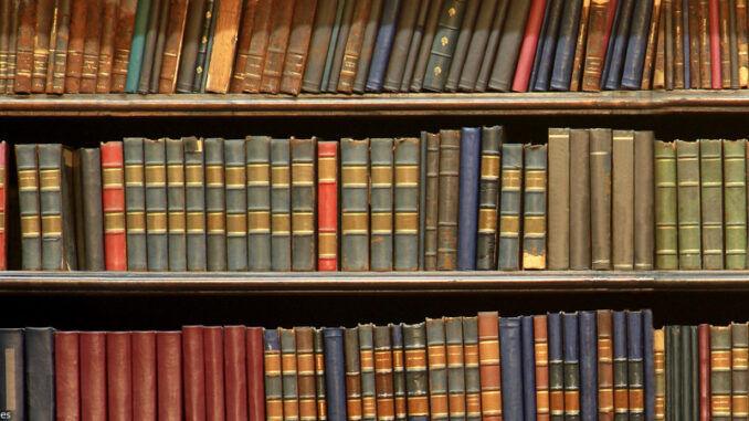 FS_02P_112013 hardcover books lined up on bookshelves