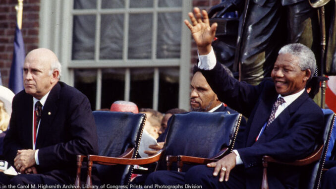 FS_01P_120613 F.W. de Klerk, left, the last president of apartheid-era South Africa, and Nelson Mandela, his successor, wait to speak in Philadelphia, Pennsylvania