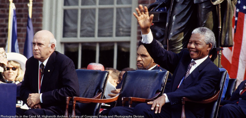 F.W. de Klerk, left, the last president of apartheid-era South Africa, and Nelson Mandela, his successor, wait to speak in Philadelphia, Pennsylvania