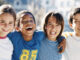 City kids posing for the camera outdoors. Photo: Banana Stock/age fotostock