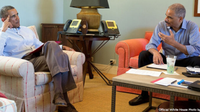 President Barack Obama talks with Attorney General Eric Holder to discuss the situation in Ferguson, Mo., in Chilmark, Martha's Vineyard, Mass., August 14, 2014. (Official White House Photo by Pete Souza)