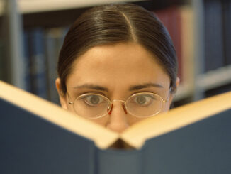 Woman reading book (focus on woman's face)