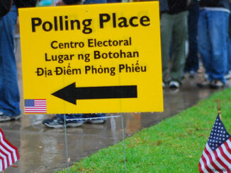 Vote! Voters waiting in rain at polling place