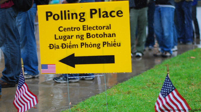 092214_01P_FS Vote! Voters waiting in rain at polling place