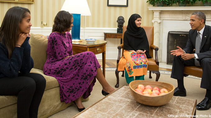 101614_01P_FS President Barack Obama, First Lady Michelle Obama, and their daughter Malia meet with Malala Yousafzai, the young Pakistani schoolgirl who was shot in the head by the Taliban a year ago, in the Oval Office, Oct. 11, 2013.