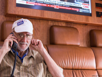 Alan Gross talks on the phone with President Barack Obama onboard a government plane during the flight from Cuba to Joint Base Andrews, Maryland, Dec. 17, 2014. Official White House Photo by Lawrence Jackson
