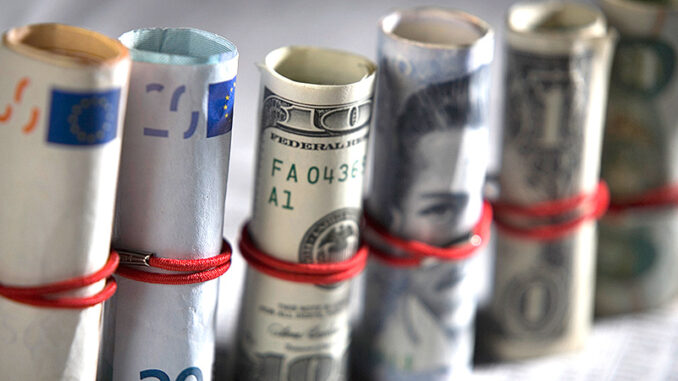 022015_01P_FS Close-up of paper currency rolls. Photo: Glow Images
