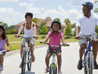 Family cycling. Photo: Spotmatik/Getty Images