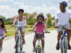 Family cycling. Photo: Spotmatik/Getty Images