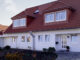 House in a residential area. Photo: George Hammerstein/Corbis/Glow Images.