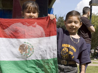 Young Hispanic children and young adults march to protest legislation increasing penalties for illegal immigrants and those who harbor them. Photo: John Flournoy/McGraw-Hill Education