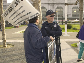 Man with protest sign. Photo: McGraw-Hill Education