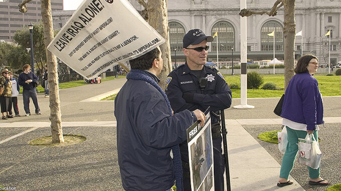 052215_01P_FS Man with protest sign. Photo: McGraw-Hill Education