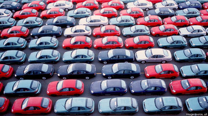 052915_02P_FS Full-frame view of rows of new cars parked in an outdoor parking lot. Photo: Image Source, all rights reserved
