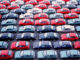 Full-frame view of rows of new cars parked in an outdoor parking lot. Photo: Image Source, all rights reserved