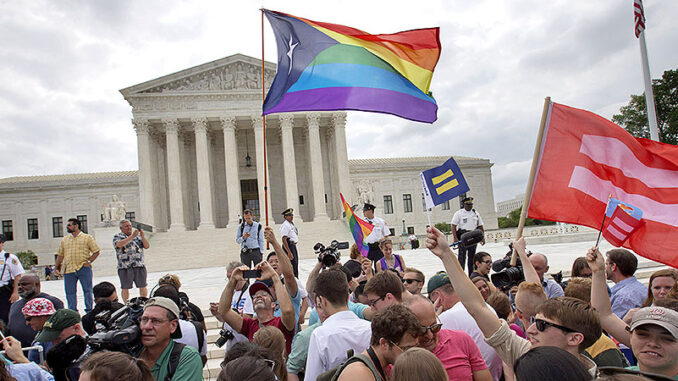 062915_01P_FS The crowd reacts as the ruling on same-sex marriage was announced outside of the Supreme Court in Washington, Friday June 26, 2015. Photo: AP Photo/Jacquelyn Martin
