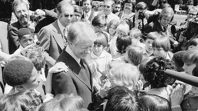 [President Jimmy Carter (1924-)surrounded by school children in North Carolina]. Photo: Library of Congress Prints & Photographs Division [LC-DIG-ppmsca-09777]. Thomas J. O'Halloran, photographer.