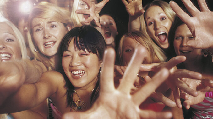 SuperStock_1527R-510035 Female fans reaching towards camera. MHE World. Photo: Exactostock/Superstock