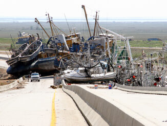 Stacked up boats at bridge following Hurricane Katrina.