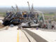 Stacked up boats at bridge following Hurricane Katrina.