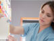 Head and shoulders view of an Asian nurse filing medical charts. DreamPictures/Jensen Walker/Getty Images. Blend Images. single image purchase by SEG from Getty Images Oct-14 (PA4). MHE Canada MHE USA