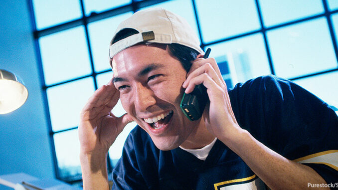 1574R-01150 Businessman talking on a mobile phone. Purestock/SuperStock. MHE World.