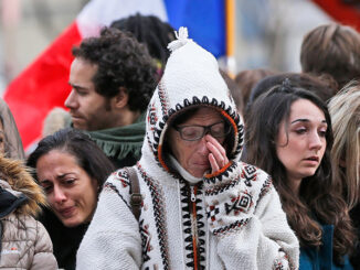 People pay respect to the victims in front of the Carillon Restaurant in Paris, Monday, Nov. 16, 2015, where terrorists attacked last Friday. Thousands of French troops deployed around Paris and tourist sites stood shuttered in one of the most visited cities on Earth. Frank Augstein/AP Images. http://www.apimages.com/metadata/Index/France-Paris-Attacks/4ad5d96a48674b61aca70833d8c278f3/1/0.