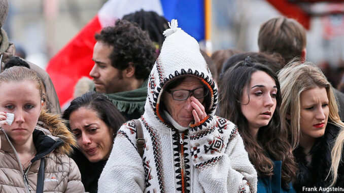 AP_978762439175 People pay respect to the victims in front of the Carillon Restaurant in Paris, Monday, Nov. 16, 2015, where terrorists attacked last Friday. Thousands of French troops deployed around Paris and tourist sites stood shuttered in one of the most visited cities on Earth. Frank Augstein/AP Images. http://www.apimages.com/metadata/Index/France-Paris-Attacks/4ad5d96a48674b61aca70833d8c278f3/1/0.