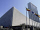Low-angle view of the United Nations building complex, New York City, USA, with unrecognizable people milling around. Purestock/SuperStock. MHE World.