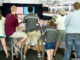 Audience members standing on treadmills listen as President Barack Obama makes remarks at the University of Wisconsin at La Crosse in La Crosse, Wisc., July 2, 2015. © Official White House Photo by Pete Souza. https://www.whitehouse.gov/photos-and-video/photogallery/july-2015-photo-day.