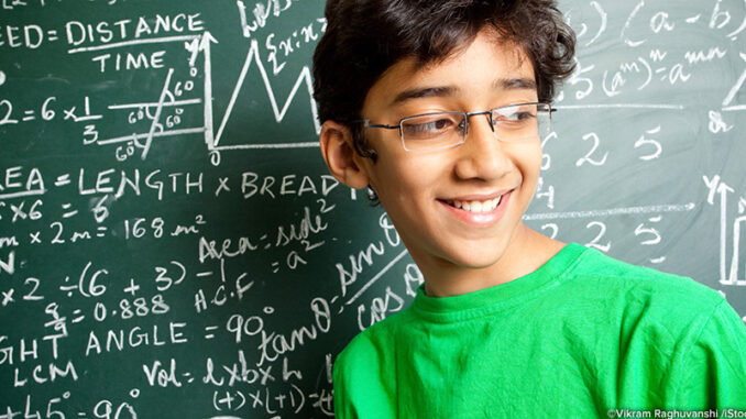 12511561-F Cheerful Indian Teenager Boy Student with Mathematics Problems. ©Vikram Raghuvanshi /iStockphoto.com. MHE Canada;MHE USA