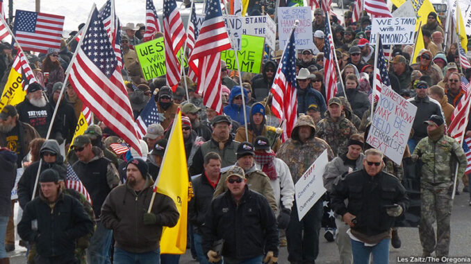 AP_433919127464 Protesters march on Court Avenue in support of an Oregon ranching family facing jail time for arson in Burns, Ore., Saturday, Jan. 2, 2016. Family members were convicted of the arsons three years ago and served time. But a judge ruled their terms were too short under federal law and ordered them back to prison for about four years each. Les Zaitz/The Oregonian/AP Images. http://www.apimages.com/metadata/Index/Ranching-Standoff-Protest/981dffea475246ecaa3564f55c8df9be/1/0