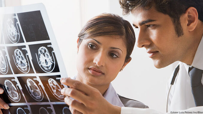 BLD038373-J Indian doctors looking at x-rays. ©Jose Luis Pelaez Inc/Blend Images LLC. MHE World.