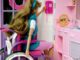 This was one of three images, (PHIL# 9135 - 9137), depicting an attempt by a toy manufacturer to produce a toy character which displayed characteristics that emulated those of a mobility-challenged person who was a wheelchair user. This disabled character was portrayed in the manner that echoed the style of the rest of their toy line. In doing so, the manufacturer tried to, in a sense, mainstream the knowledge of what is faced by the disabled in the real world through play, and therefore, was as educational, as it was entertaining to the childhood end user demographic group. PHIL image 9137, showed Ron Mace looking through a door in the playhouse. © Center for Universal Design/CDC. MHE World.