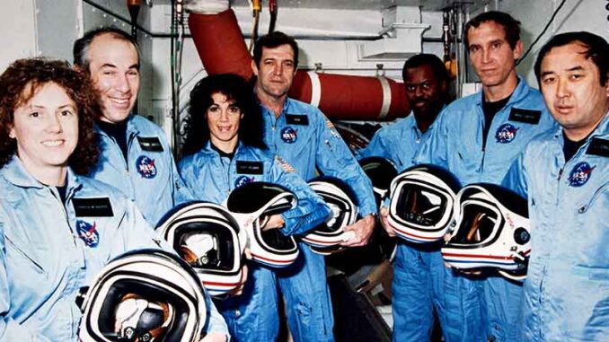 020315_02P_FS The NASA family lost seven of its own on the morning of Jan. 28, 1986, when a booster engine failed, causing the Shuttle Challenger to break apart just 73 seconds after launch. In this photo from Jan. 9, 1986, the Challenger crew takes a break during countdown training at NASA's Kennedy Space Center. © NASA. MHE World.