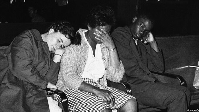 AP6105200114-copy Three members of a racially mixed group of college student "freedom riders" catch a nap on May 20, 1961 in the Birmingham bus station after they were thwarted several times in attempts to board busses to Montgomery. Left to right are Susan Hermann, Etta Simpson and Frederick Leonard. All attend college in Nashville, Tenn. © Horace Cort/AP Images. http://www.apimages.com/Search?query=6105200114&ss=10&st=kw&entitysearch=&toItem=18&orderBy=Oldest