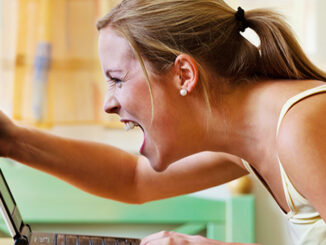 A woman angry over your computer. Problems with hardware, software and Internet shopping. Lisa S./Shutterstock. MHE World.