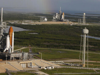 Space shuttle Atlantis (foreground) sits on Launch Pad A and Endeavour on Launch Pad B at NASA's Kennedy Space Center in Florida. At the left of each shuttle are the open rotating service structures with the payload changeout rooms revealed. The rotating service structures provide protection for weather and access to the shuttle. For the first time since July 2001; two shuttles are on the launch pads at the same time. Endeavour will stand by at pad B in the unlikely event that a rescue mission is necessary during Atlantis' upcoming STS-125 mission to repair NASA's Hubble Space Telescope. Troy Cryder/NASA. MHE World