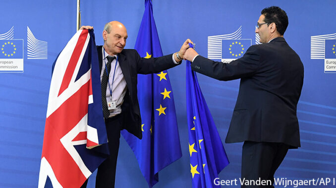 062816_01P_FS Members of protocol adjust the British and EU flags prior to the arrival of British Prime Minister David Cameron at EU headquarters in Brussels on Tuesday, June 28, 2016. EU heads of state and government meet Tuesday and Wednesday in Brussels for the first time since Britain voted to leave the European Union, throwing British and European politics into disarray. Geert Vanden Wijngaert/AP Images. http://www.apimages.com/metadata/Index/Belgium-Britain-EU/a711262c12ed41458b95044bb59daf59/1/0