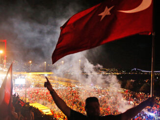 In this Thursday, July 21, 2016 file photo, pro-government supporters protest against the attempted coupon, on the road leading to Istanbul's iconic Bosporus Bridge, background left. Turkish Prime Minister Binali Yildirim said Monday, July 25, 2016 that Istanbul's Bosporus Bridge will be renamed "July 15th Martyrs' Bridge" in honor of civilians who died resisting Turkey's coup attempt. ASSOCIATED PRESS. http://www.apimages.com/metadata/Index/Turkey-Bosporus-Bridge/4d529ee768f247b5983a753a59411926/1/0.