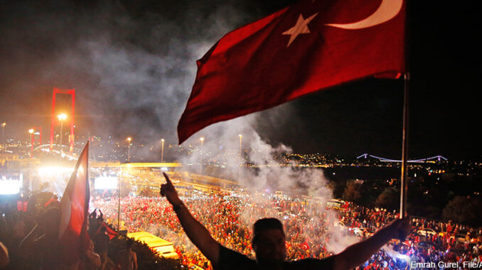 072616_01P_FS In this Thursday, July 21, 2016 file photo, pro-government supporters protest against the attempted coupon, on the road leading to Istanbul's iconic Bosporus Bridge, background left. Turkish Prime Minister Binali Yildirim said Monday, July 25, 2016 that Istanbul's Bosporus Bridge will be renamed "July 15th Martyrs' Bridge" in honor of civilians who died resisting Turkey's coup attempt. ASSOCIATED PRESS. http://www.apimages.com/metadata/Index/Turkey-Bosporus-Bridge/4d529ee768f247b5983a753a59411926/1/0.