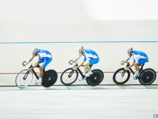 Full-length profile view of four cyclists racing around a velodrome track. Chris Ryan/Getty Images. MHE Canada;MHE USA.