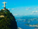 Christ the Redeemer statue overlooking Rio de Janeiro and Sugarloaf Mountain, Brazil. Rivers Dale/Image Source. MHE World.