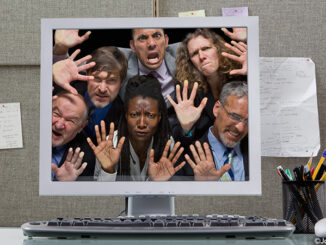 Business people trapped in computer monitor. ©John Lund/Blend Images LLC. MHE World